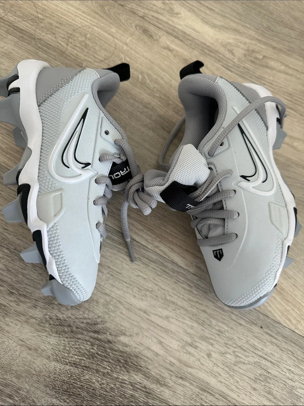 Nike Light Gray and White Cleats with Black Swoosh